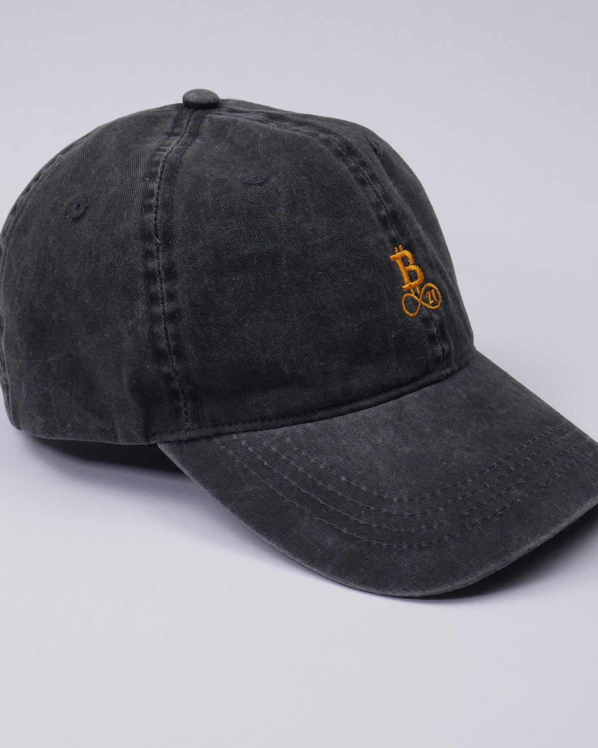 Washed Bitcoin cap made from organic cotton in black, side view, studio shot