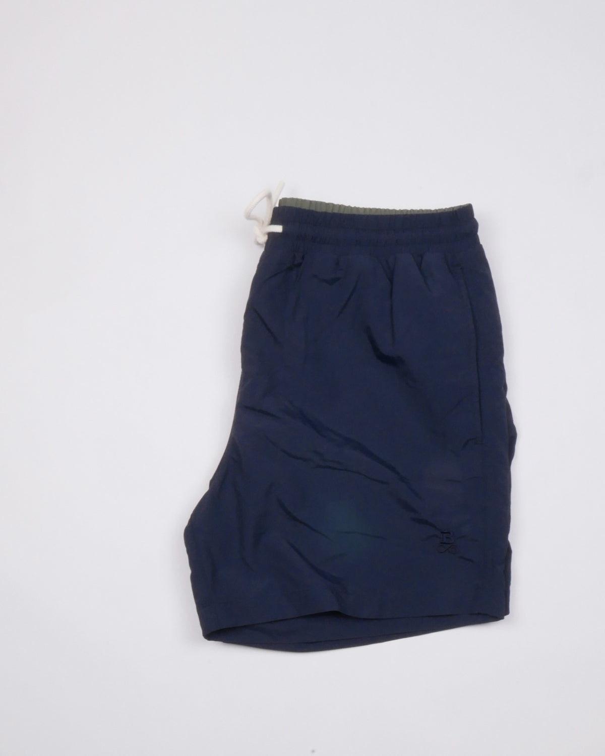 Bitcoin Swim Trunks Privacy in Navy Blue, folded with drawstring and tone-on-tone embroidered Bitcoin21 logo