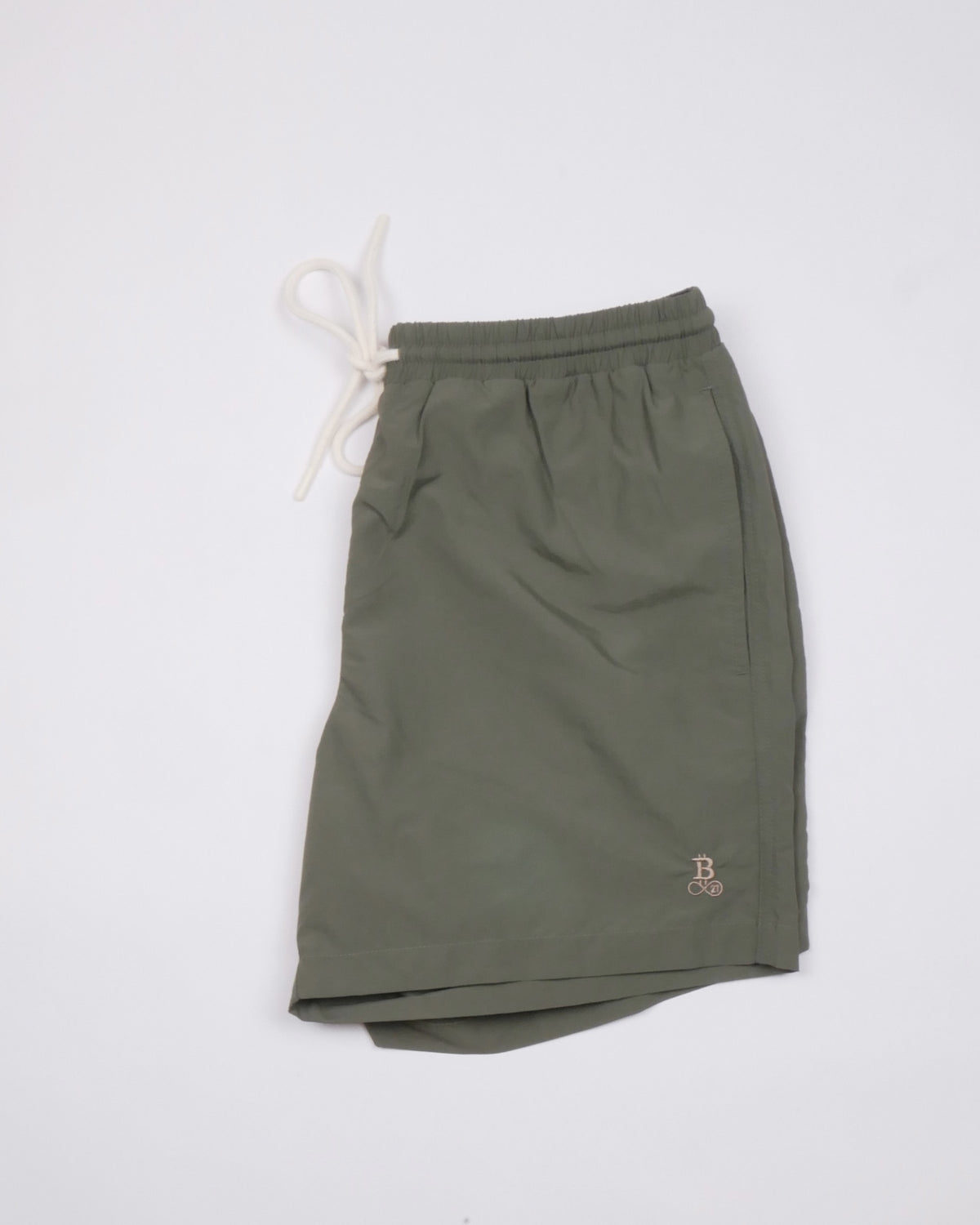 Bitcoin Swim Trunks Privacy in Khaki, folded with drawstring and tone-on-tone embroidered Bitcoin21 logo