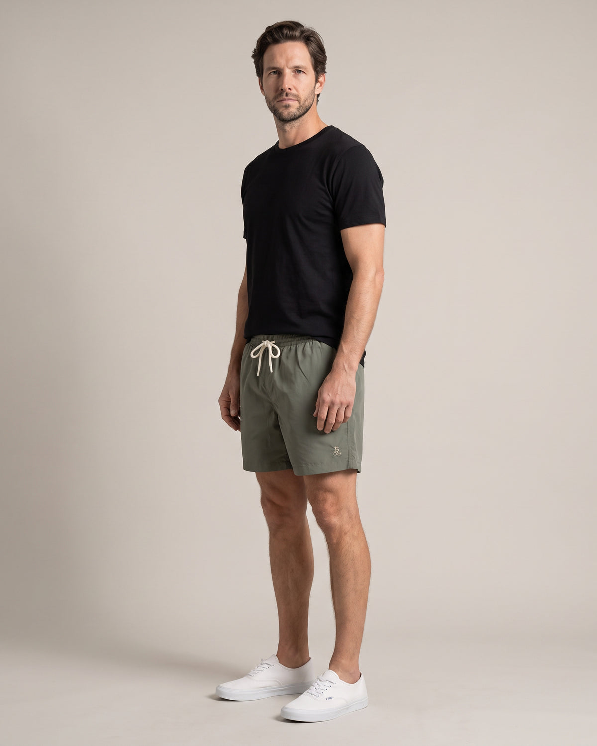 Bitcoin Swim Trunks Privacy in Khaki, worn, front view with tone-on-tone embroidered Bitcoin21 logo