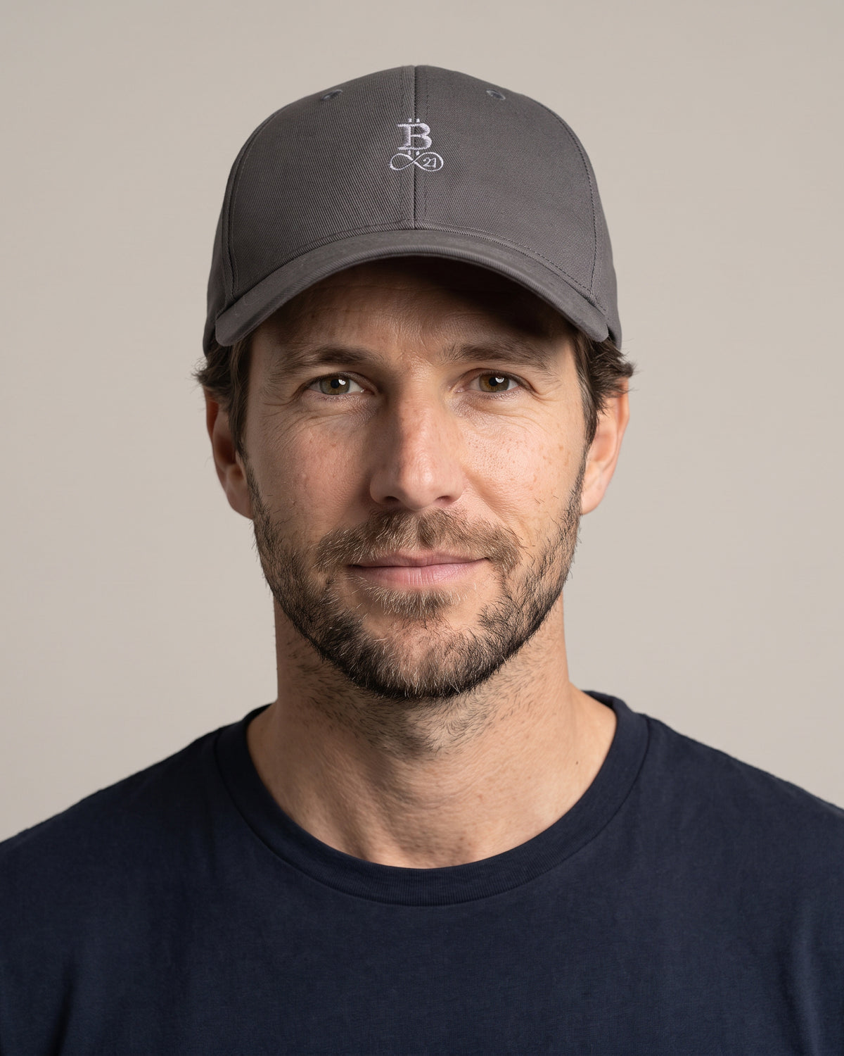 Bitcoin Cap Privacy in Dark Grey, worn, front view with tone-on-tone embroidered Bitcoin21 logo