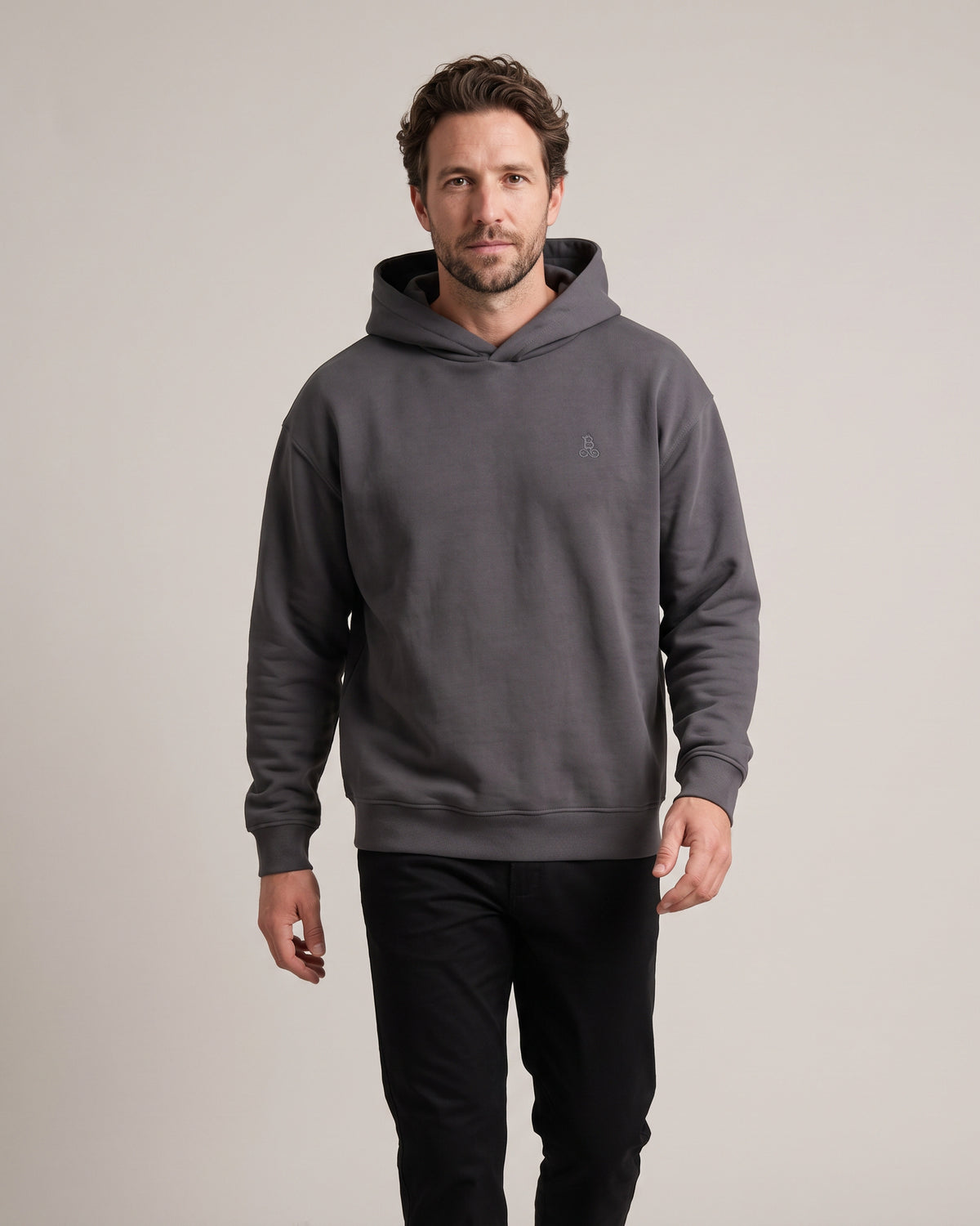 Bitcoin Oversized Hoodie Privacy in Dark Grey, worn, front view with tone-on-tone embroidered Bitcoin21 logo