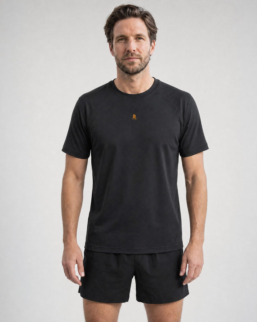 Man wearing the Bitcoin Running Shirt - Running Bitcoin Performance Shirt in black, small orange Bitcoin21 logo on the front