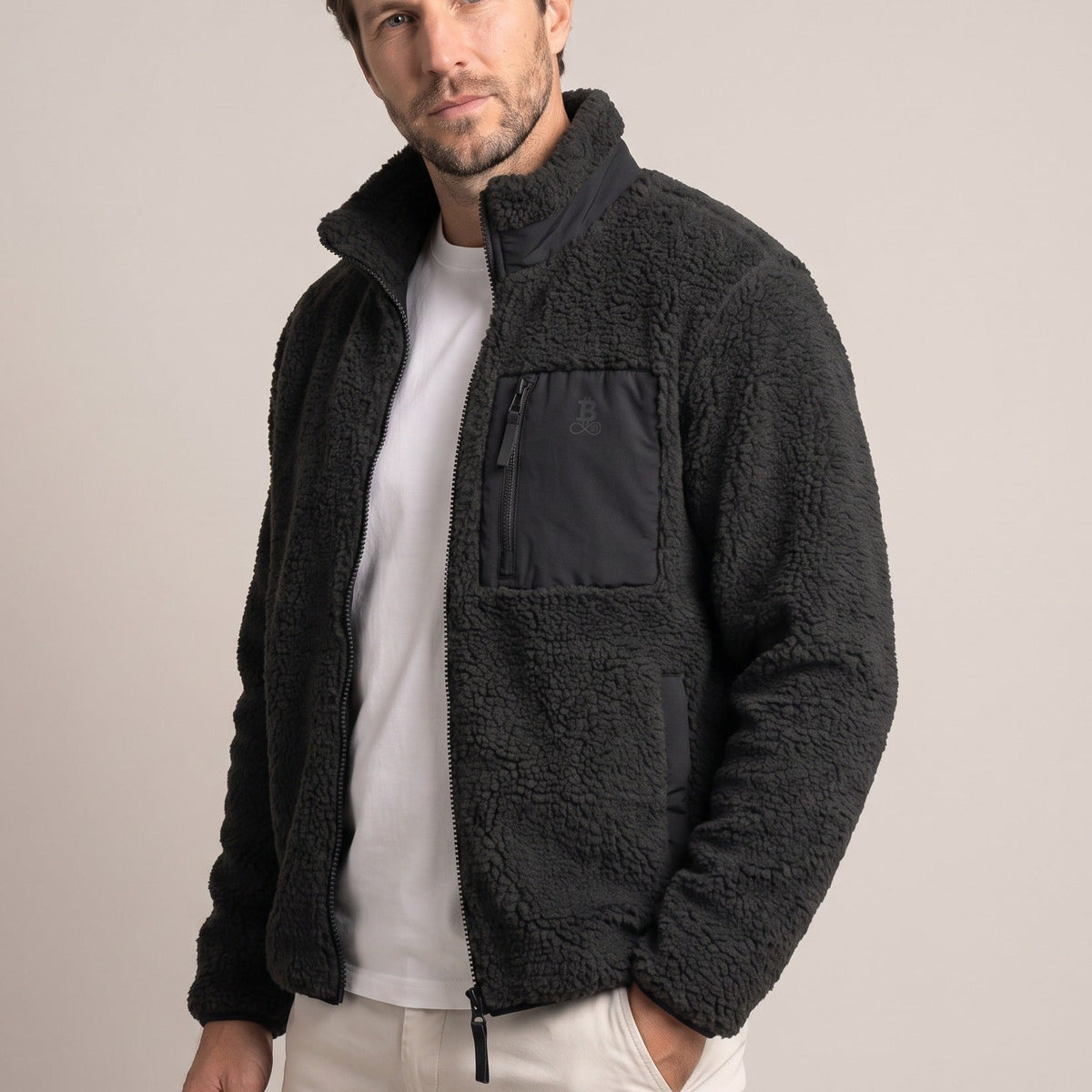 Bitcoin Sherpa Jacket Privacy in Black, worn, front view with tone-on-tone printed Bitcoin21 logo on the chest pocket