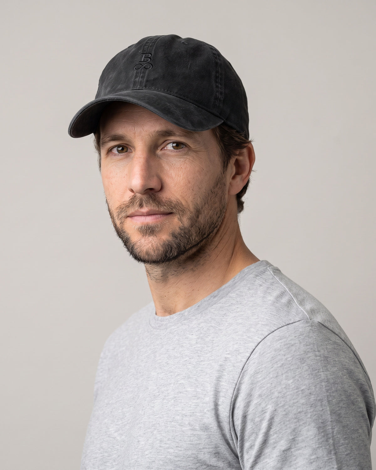Washed Bitcoin Cap Privacy in Black, worn, front view with tone-on-tone embroidered Bitcoin21 logo