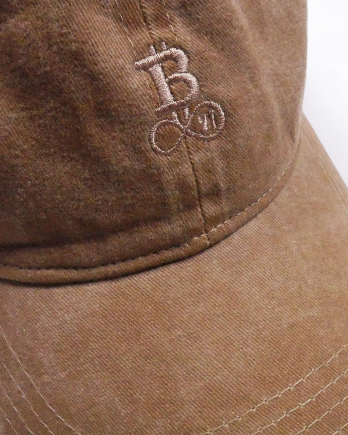 Washed Bitcoin Cap Privacy in Dark Camel, close-up of the tone-on-tone embroidered Bitcoin21 logo