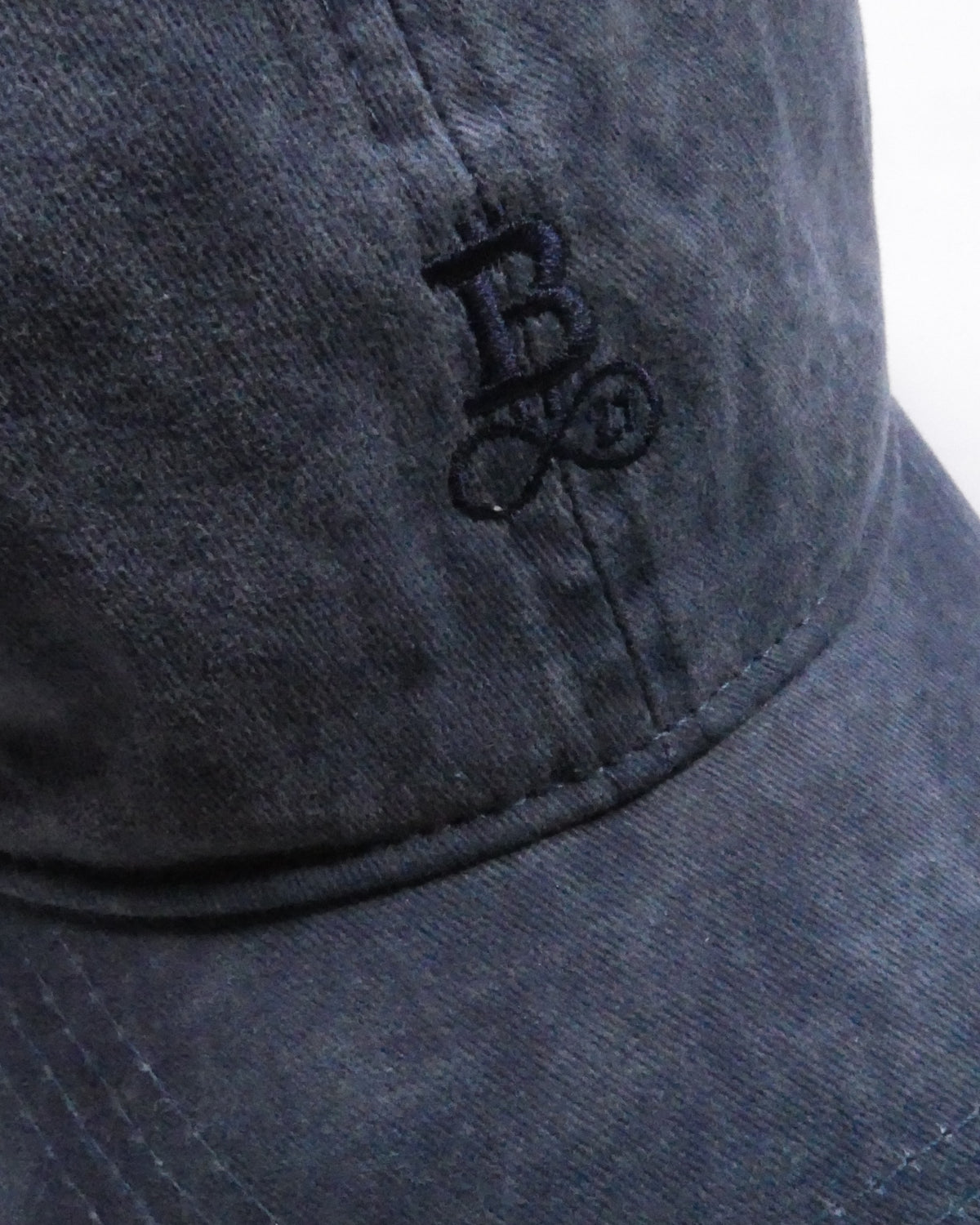 Washed Bitcoin Cap Privacy in Navy Blue, close-up of the tone-on-tone embroidered Bitcoin21 logo