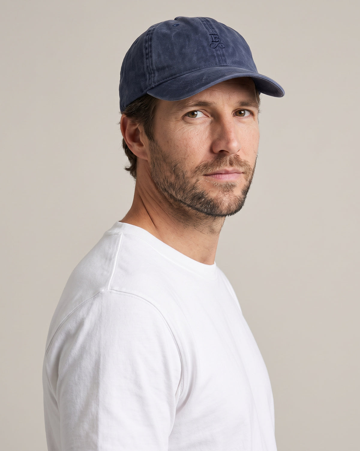 Washed Bitcoin Cap Privacy in Navy Blue, worn, front view with tone-on-tone embroidered Bitcoin21 logo