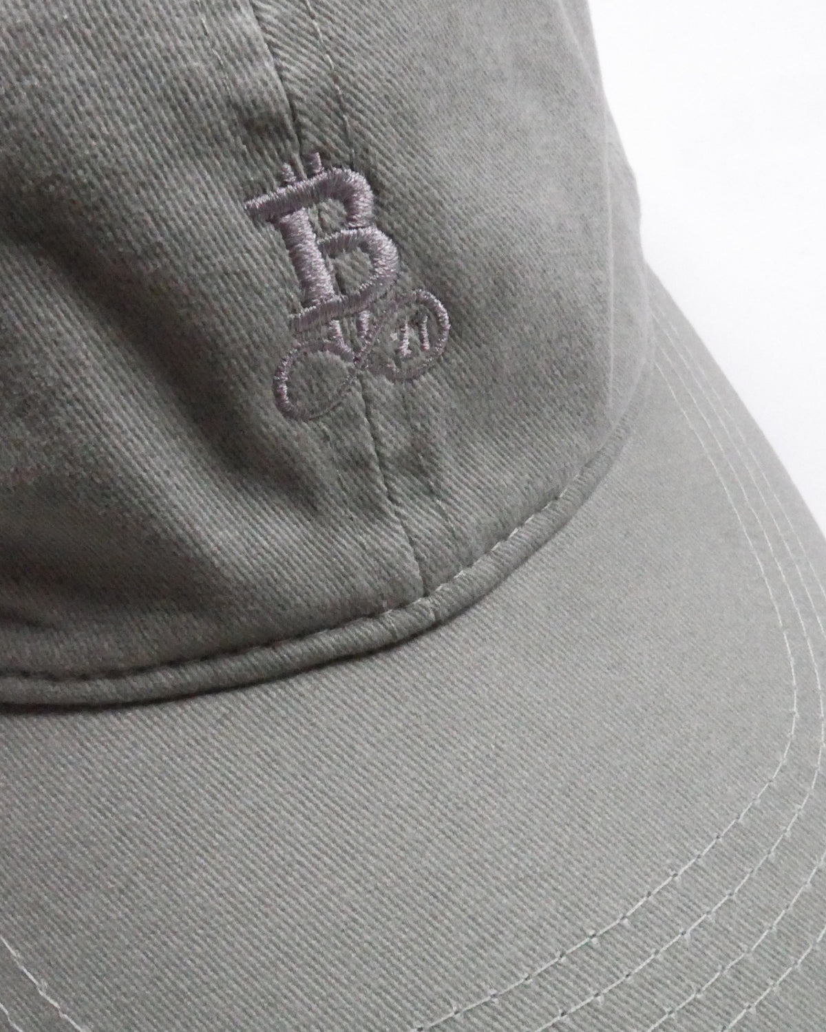 Washed Bitcoin Cap Privacy in Almond Green, close-up of the tone-on-tone embroidered Bitcoin21 logo
