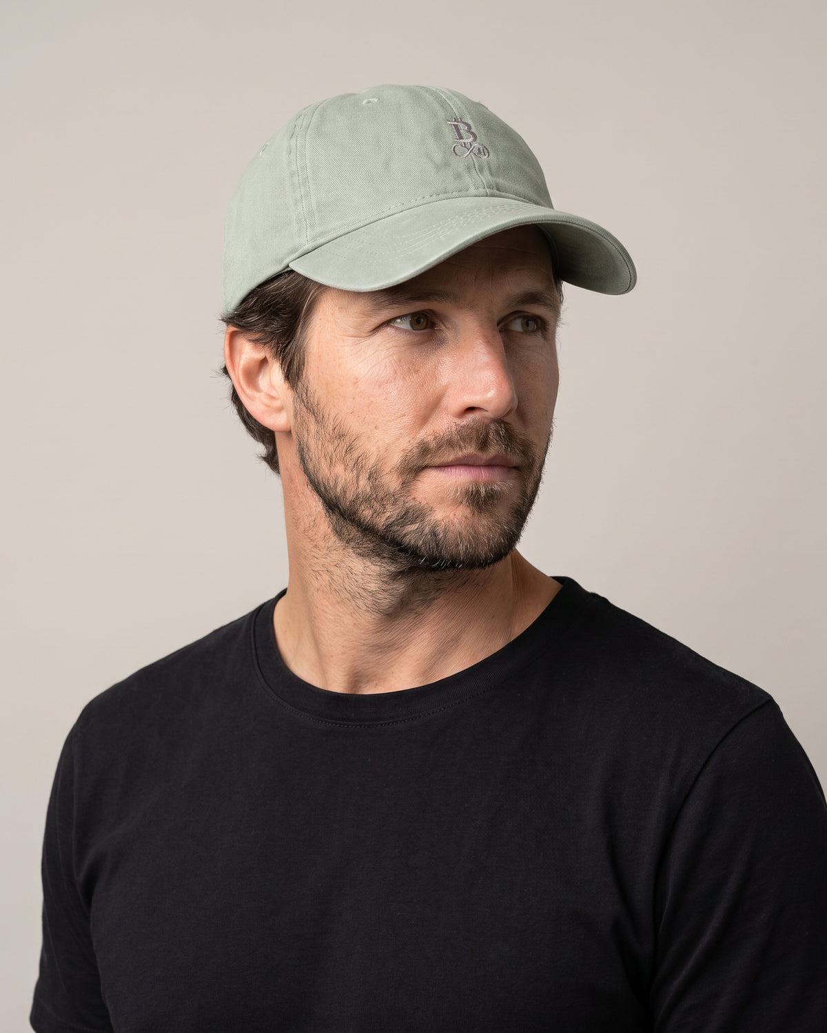 Washed Bitcoin Cap Privacy in Almond Green, worn, front view with tone-on-tone embroidered Bitcoin21 logo