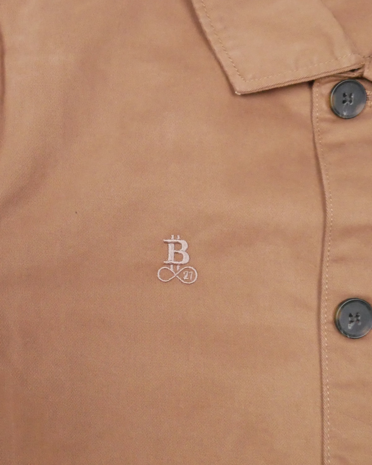 Bitcoin Worker Jacket Privacy in Washed Dark Camel, close-up of the tone-on-tone embroidered Bitcoin21 logo