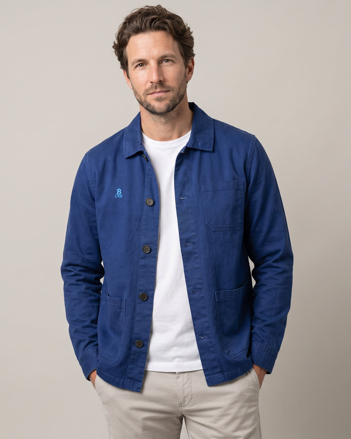 Bitcoin Worker Jacket Privacy in Washed Indigo, worn, front view with tone-on-tone embroidered Bitcoin21 logo