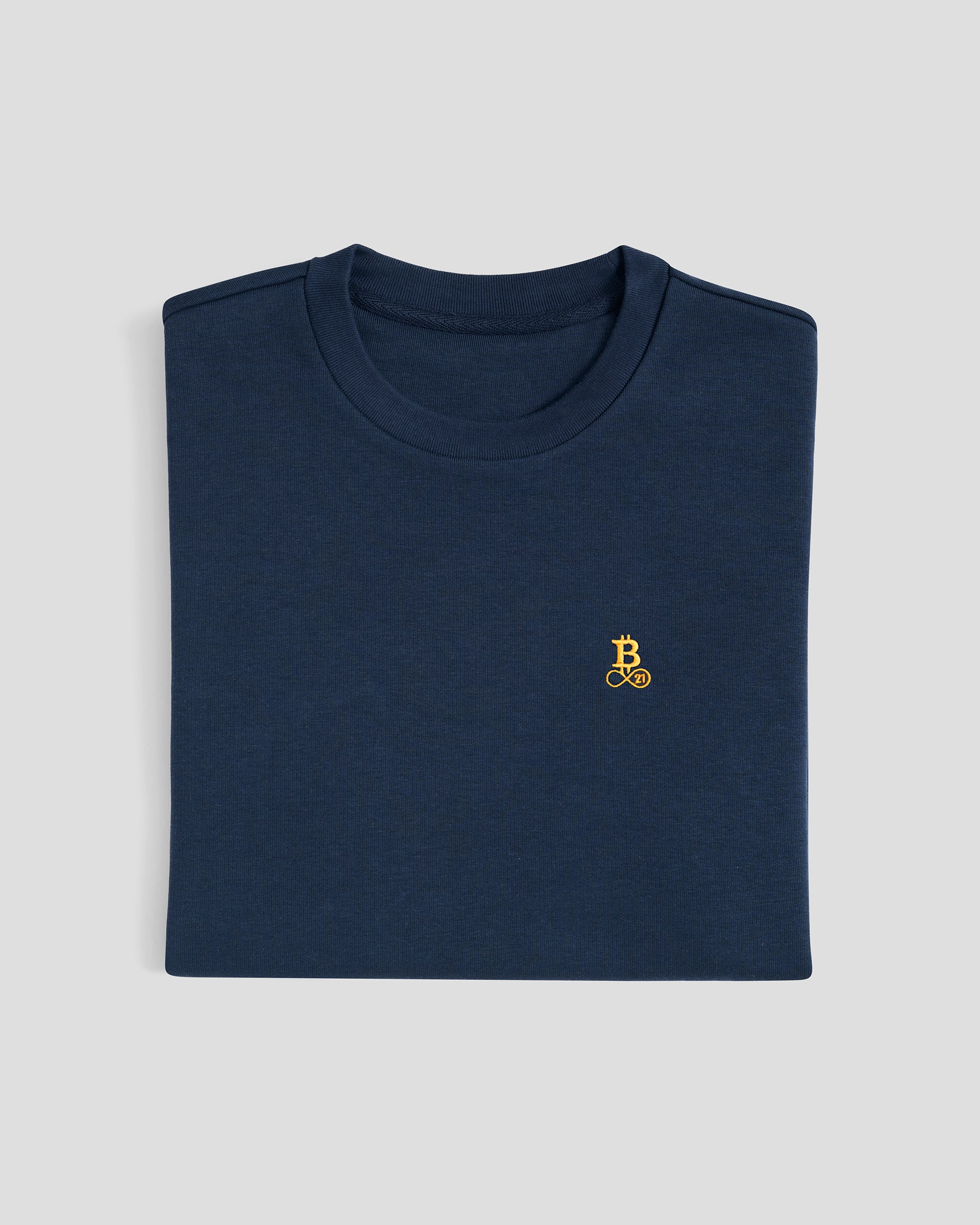 Bitcoin Oversized T-Shirt in Blau für Herren aus schwerer Bio Baumwolle mit orangefarbenen gesticktem Bitcoin21 Logo, zusammengefaltet