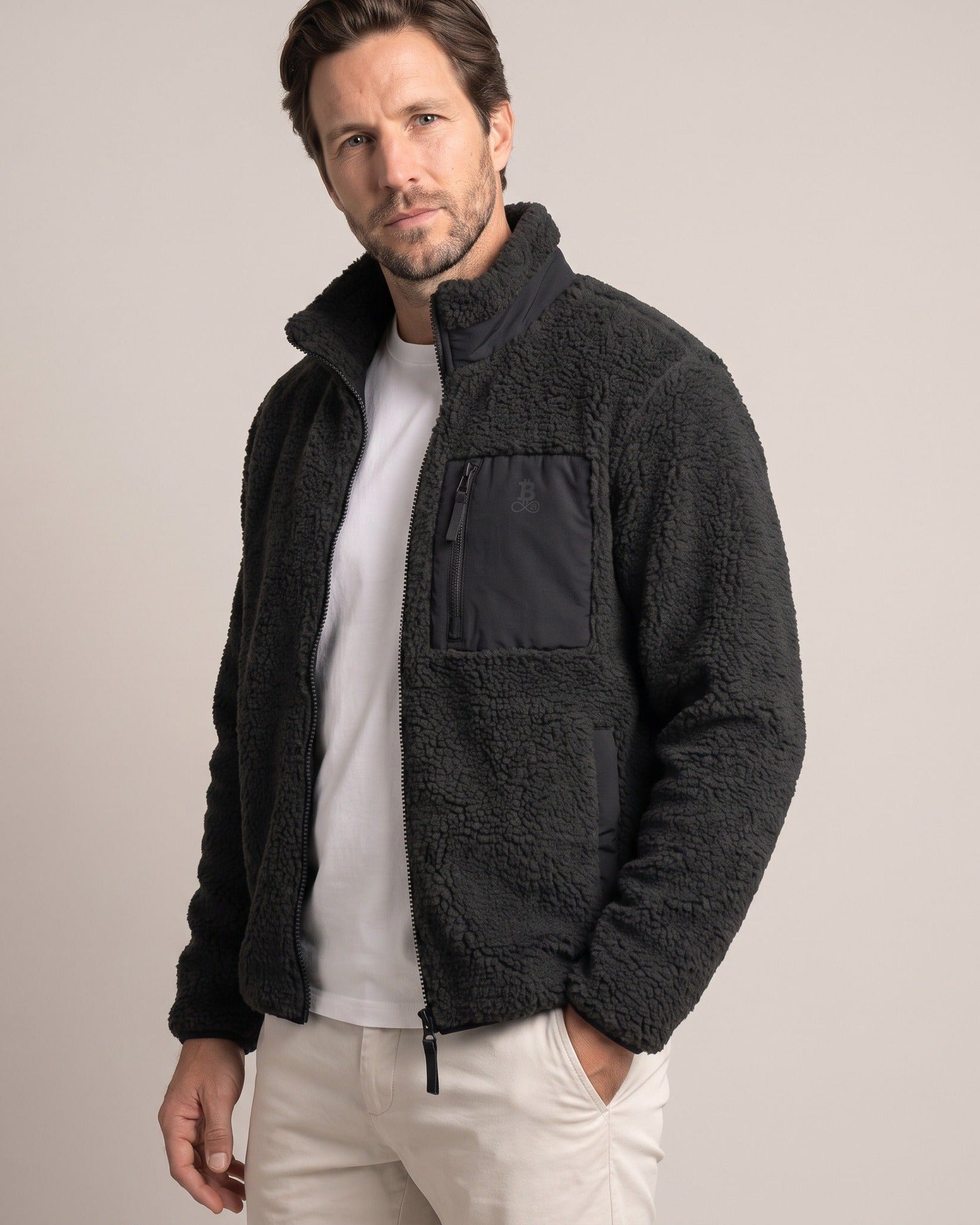 Bitcoin Sherpa Jacket Privacy in Black, worn, front view with tone-on-tone printed Bitcoin21 logo on the chest pocket