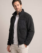 Bitcoin Sherpa Jacket Privacy in Black, worn, front view with tone-on-tone printed Bitcoin21 logo on the chest pocket