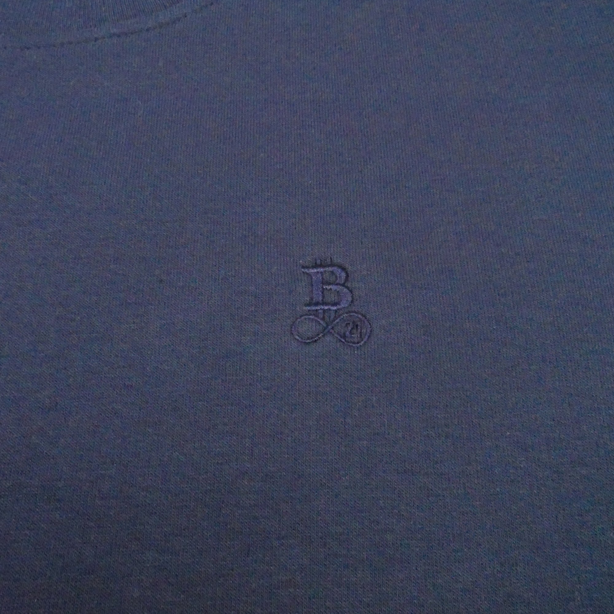 Bitcoin Sweatshirt Privacy in Navy, close-up of the tone-on-tone embroidered Bitcoin21 logo