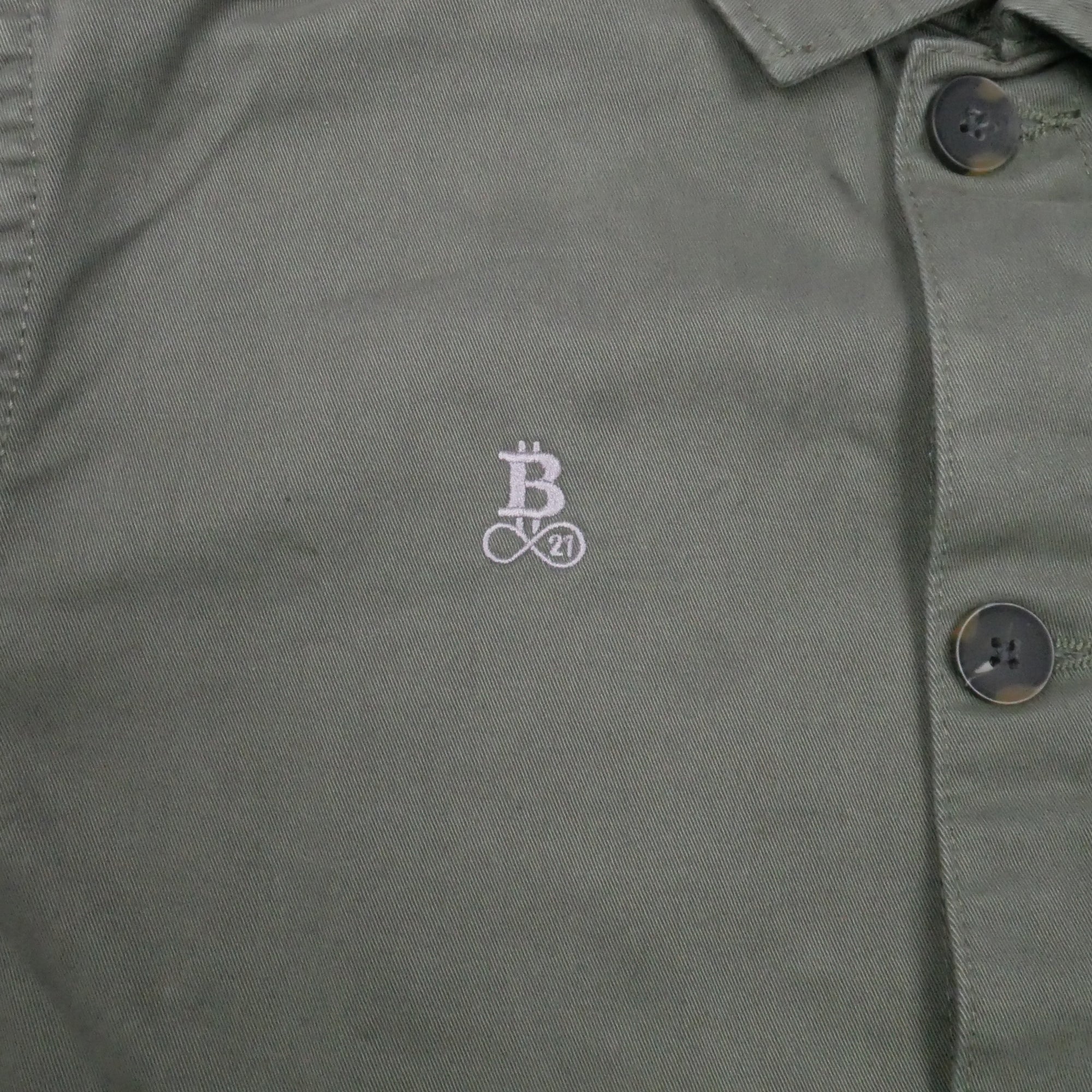 Bitcoin Worker Jacket Privacy in Washed Organic Khaki, close-up of the tone-on-tone embroidered Bitcoin21 logo